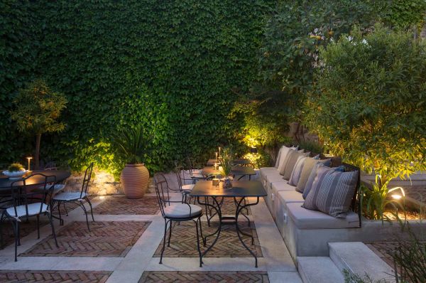 Mystical evenings: Immerse in the enchanting ambience of Almayer Art & Heritage Hotel's lush secret garden