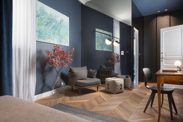 Interior of Standard double room 'Battara' with a mirrored wall reflecting an artsy ambience at Almayer Art & Heritage Hotel's annexe building.