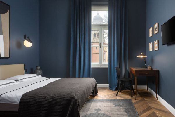 Inviting cosiness: Interior of Standard double room 'Brkan' at Almayer Art & Heritage Hotel's annexe building, offering a charming city view.