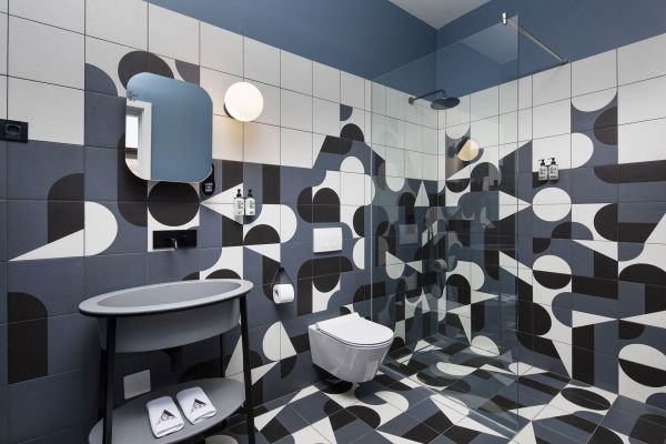 Artistry underfoot: Designer tiles adorn the Deluxe Double Room 'Bianchini' bathroom at Almayer Art & Heritage Hotel's annexe building