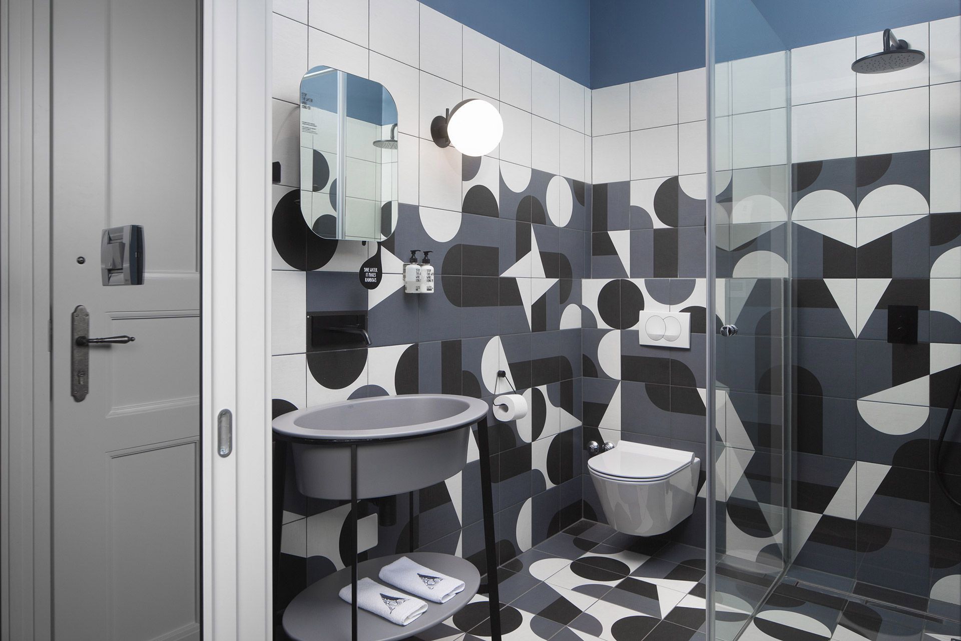 Designer ceramic tiles bathroom interior design of the standard double room in Almayer hotel’s dependance