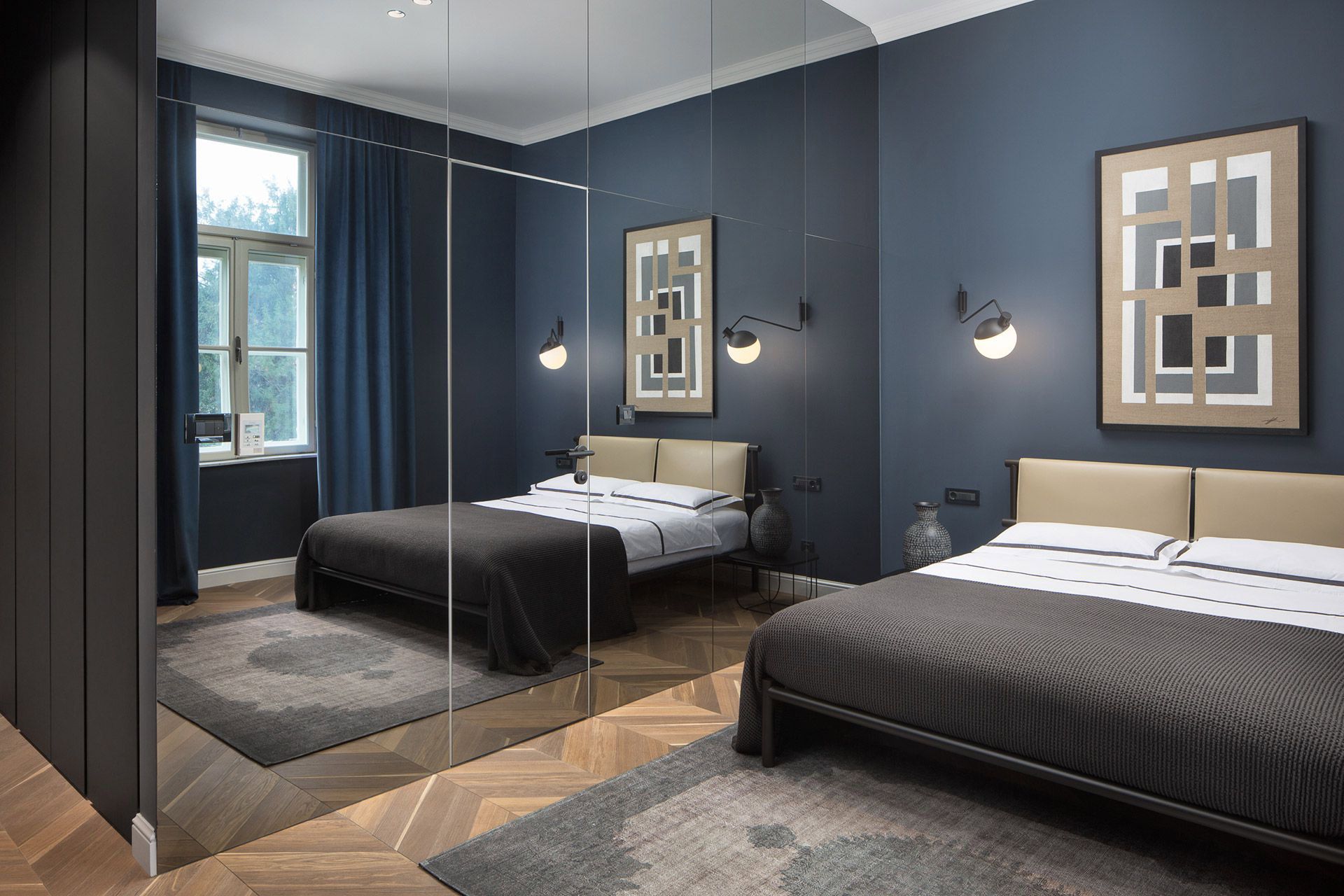 Exclusive bedroom design with a queen-size bed in Almayer hotel’s deluxe double room Bianchini in dependance